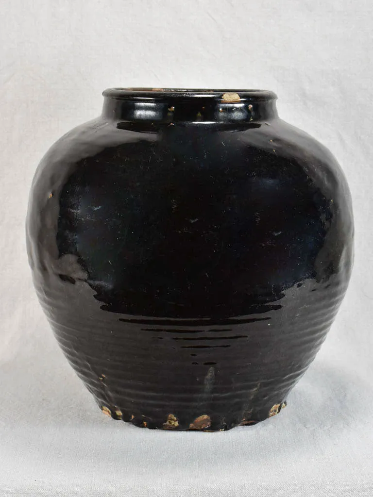 Large decorative antique pot with black glaze and ribbed base 14½"